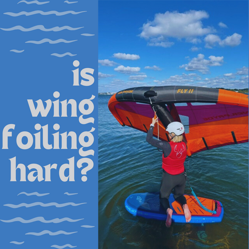 Person learning wing foiling on water with inflatable wing and foil board under blue sky